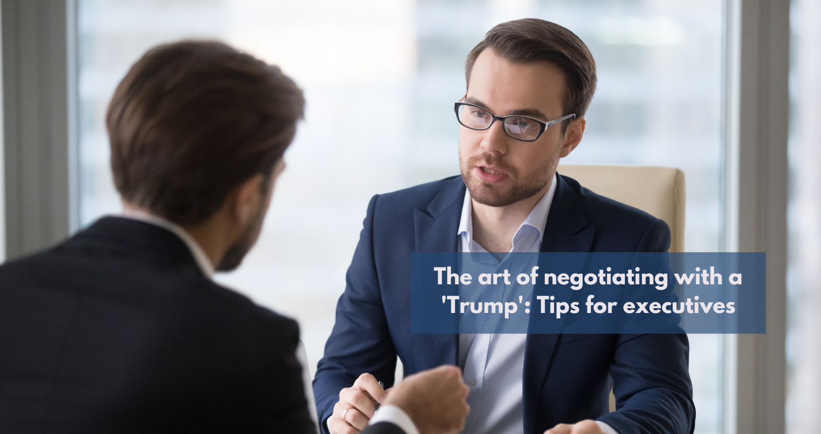 Image of a tense negotiation meeting, with two people on opposite sides of a table, emphasizing the importance of strategy and calmness.